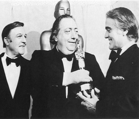 Actor Gene Kelly (L) & Jack Valenti (R),
Motion Picture Association of America chairman,
present Henri Langlois with an honorary
Academy Award in 1974 for his work with the
Cinematheque Francaise