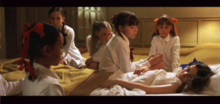 Bedridden Bianca (Berangere Haubruge)
surrounded by her classmates
Photo: Leisure Time/Home Vision Entertainment