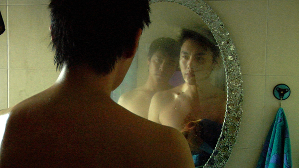 Chen Sicheng, left in mirror, & Qin Hao in SPRING FEVER (Photo: Strand Releasing)