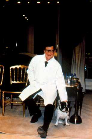 Yves Saint Laurent in his studio with his French bulldog, Moujik (Photo: Thierry Chomet)